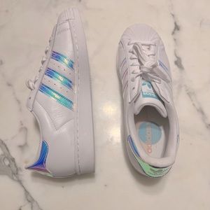 Adidas superstar iridescent stripes.
